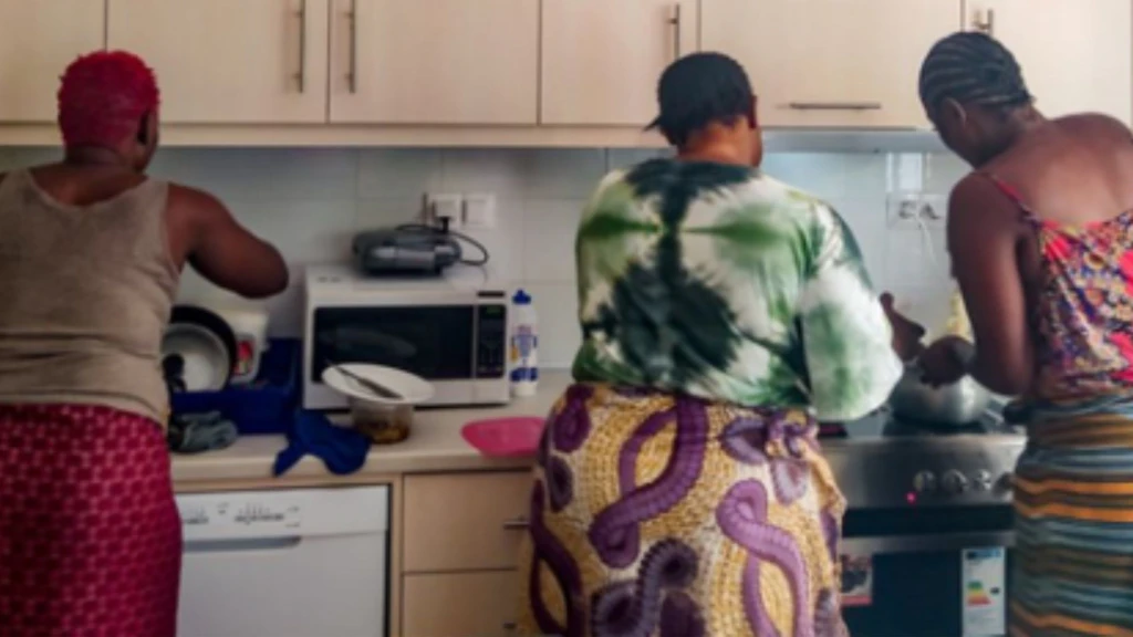 Women in the kitchen of "A Step Forward"
